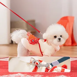 Winter warm dog vest with red koi fish design and integrated leash hook attachment