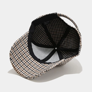 Classic houndstooth baseball cap with detailed inner stitching and reinforced black tape