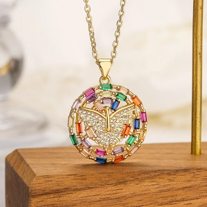Gold butterfly pendant necklace with colorful zircons on a wooden display stand