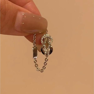 Silver horseshoe buckle chain ring with sparkling cubic zirconia on a minimalist band