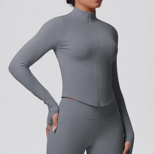 Detail of dark grey yoga jacket featuring stand collar and thumb holes for fitness
