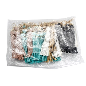 Bulk pack of colorful PU leather tassel keychains with gold lobster clasps in 5 colors