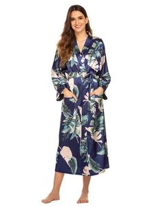 Close-up of tropical leaf print on navy satin robe with side pockets and waist tie