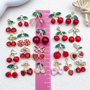 DIY cherry pendants with red enamel and crystals, 2-3cm sized on white texture