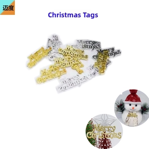 Close-up of gold and silver glitter Merry Christmas letter signs for holiday tree decoration