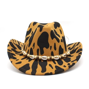 Macro detail of leopard print wool felt cowboy hat featuring shells and beads trim