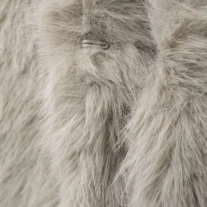Luxe light grey faux fur vest close-up featuring soft fluffy texture and metal clasp