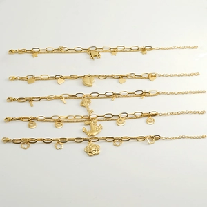 Detailed view of layered titanium steel bracelets with star, heart, and flower charms