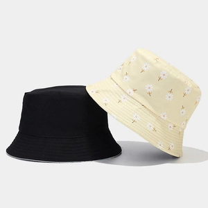 Detail showing high-quality cotton canvas fabric and daisy flower print on sun hat