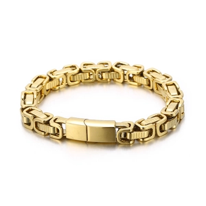 Polished gold Byzantine chain bracelet for men with textured box clasp on white surface