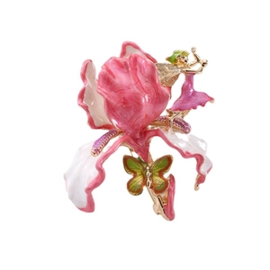 Luxurious vintage enamel flower brooch with gold fairy and butterfly detail on white backdrop