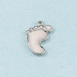 Polished silver baby footprint pendant with sparkling crystal stone and hanging ring
