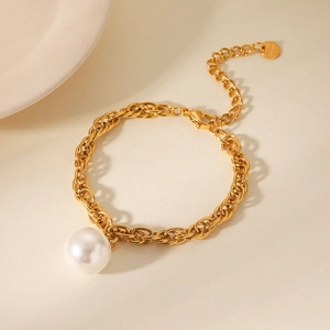 Detail of 18K gold stainless steel chain bracelet with a white pearl pendant