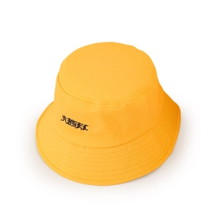 Detailed view of yellow cotton bucket hat with black Gothic ANGEL letter embroidery