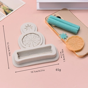 Silicone mold for cinnamon and lemon slices shown with dimensions on pink background