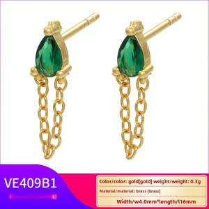 Detail of gold-plated brass earrings with pear-cut green gemstones and fine chain drops