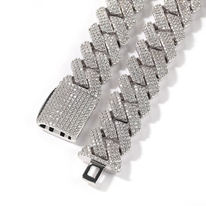 Close-up of 20mm silver iced out Cuban link chain with detailed pave zircon square clasp