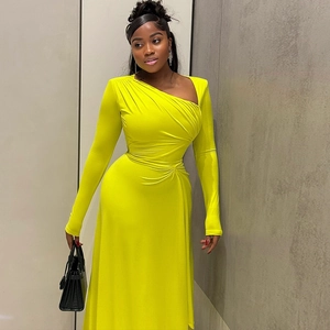 Detail of ruched waist and off-shoulder neckline on a neon yellow slim long dress