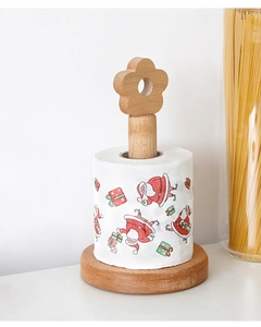 Detail of wooden vertical paper towel holder with floral top and Santa print roll