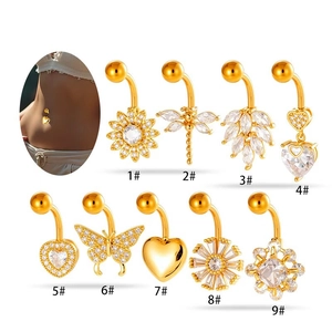 Collection of gold stainless steel belly rings with sunflower and dragonfly designs