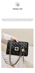 Detail of adjustable gold ball buckle on black quilted leather strap with metal chain