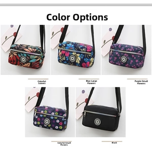 Multiple patterns of lightweight nylon crossbody bags including floral and solid black