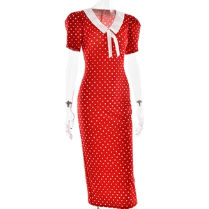Detail view of retro red polka dot dress with white lapel collar and slim fit cut