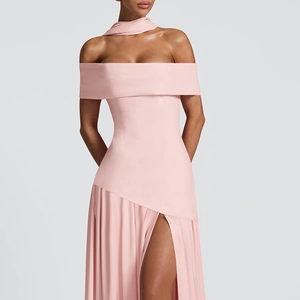 Detail of off-shoulder light pink dress featuring a high side slit and matching neck scarf