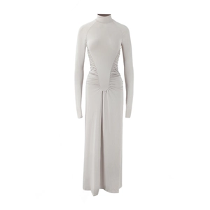Detailed view of the ruching effect and side drapes on a slim-fit turtleneck maxi dress