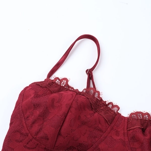 Detailed close-up of adjustable straps and lace bodice on a burgundy evening dress