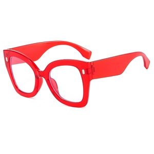 Fashionable red translucent cat eye glasses with large frame and silver rivet accents