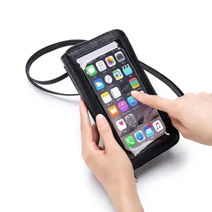 Crossbody touch screen cell phone bag in black lychee leather with clear TPU window