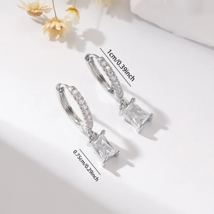 Detail of silver hoop earrings showing exact dimensions of 1cm and 0.75cm
