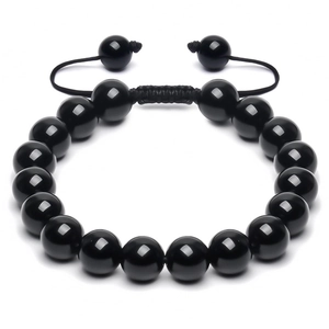 Detail of 10mm polished black onyx beaded bracelet with adjustable woven cord