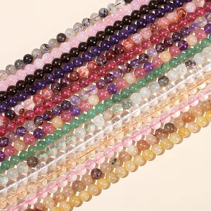 Macro shot of assorted colorful natural crystal beads including quartz and amethyst for DIY