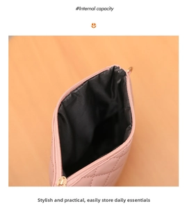 Detailed view showing the internal capacity and black fabric lining of pink quilted bag