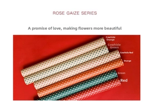 Close-up of polka dot pattern waterproof flower wrapping paper rolls in festive colors