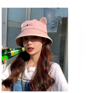 Close-up of pink bucket hat featuring 3D cat ears and whiskers embroidery detail