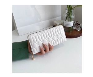 Detailed view of white quilted PU leather long wallet with metallic zipper and elegant texture