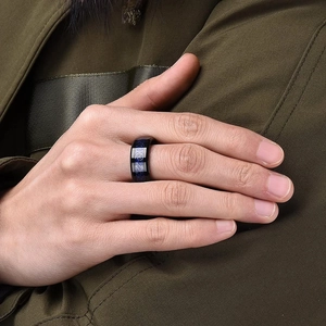 Men's black titanium steel ring with blue galaxy inlay and silver Celtic dragon pattern