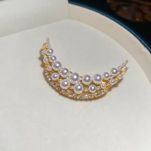 18k gold plated crescent brooch with white pearls and sparkling cubic zirconia stones