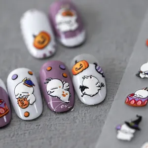 Macro shot of 5D Halloween embossed nail stickers with cute ghost and pumpkin motifs