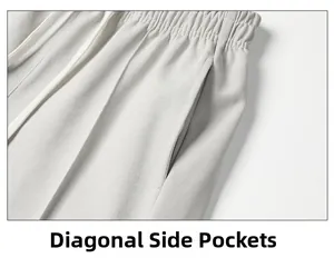 Detail view of light grey joggers featuring elastic waistband and slanted side pockets