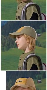 Detail of kids quick-dry baseball cap with Daniel embroidery and matching outdoor vest