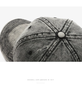 Detailed macro view of the six-panel crown stitching on a vintage acid wash baseball cap