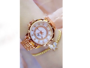 Close-up of Bee Sister rose gold watch with crystal bezel and butterfly charm bracelet