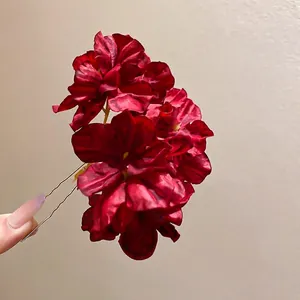 Deep red floral fabric hair pin with velvet petals and metal U-shaped fork design