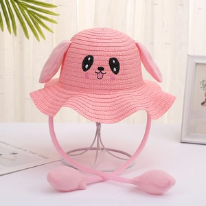 Close-up of pink straw hat for children featuring interactive moving bunny ears