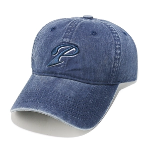 Detailed close-up of blue P letter embroidery on vintage washed denim baseball cap