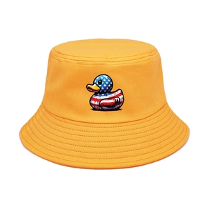 Detail of yellow cotton bucket hat featuring a cartoon duck with American flag pattern